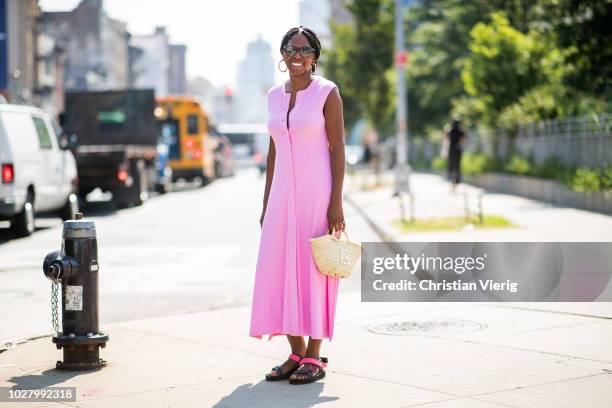 Guest wearing pink sleeveless dress is seen outside Noon By Noor during New York Fashion Week Spring/Summer 2019 on September 6, 2018 in New York...