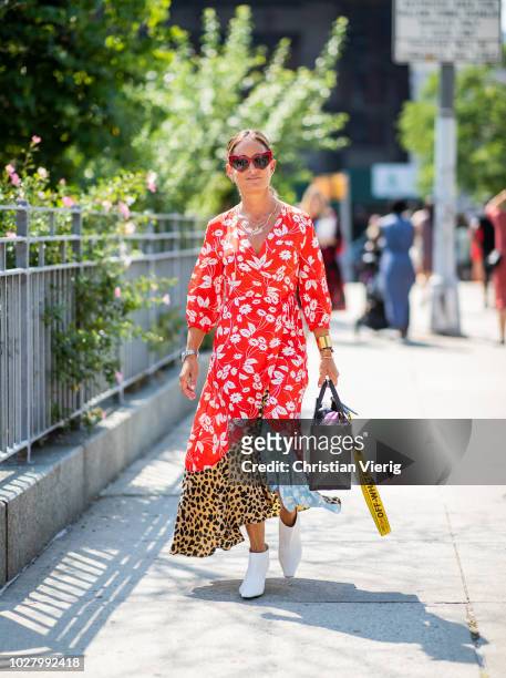 Guest wearing dress with multi prints is seen outside Noon By Noor during New York Fashion Week Spring/Summer 2019 on September 6, 2018 in New York...