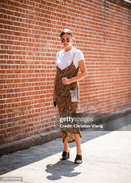 Guest wearing leopard dress, silver bag, white tshirt is seen outside Collina Strada during New York Fashion Week Spring/Summer 2019 on September 6,...