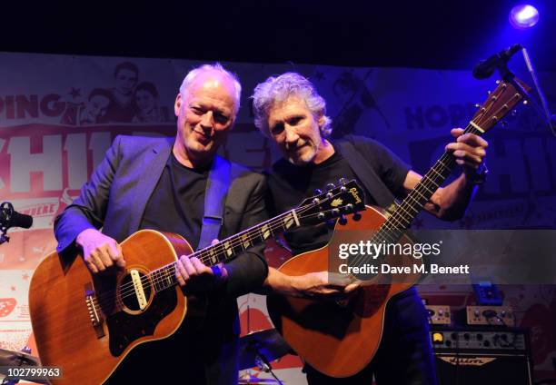 David Gilmour and Roger Waters perform at a benefit evening for The Hoping Foundation on July 10, 2010 in London, England.