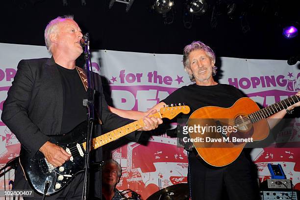 David Gilmour and Roger Waters perform at a benefit evening for The Hoping Foundation on July 10, 2010 in London, England.