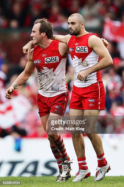 Rhyce Shaw of the Swans celebrates with Jude Bolton after kicking a goal during the round 15 AFL match between the Sydney Swans and the North...