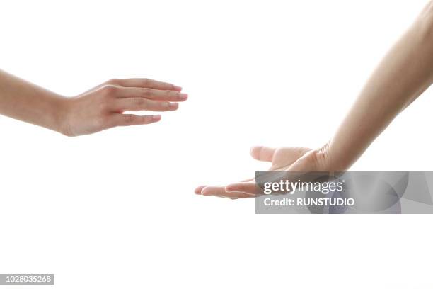 Reaching Hands High-Res Stock Photo - Getty Images