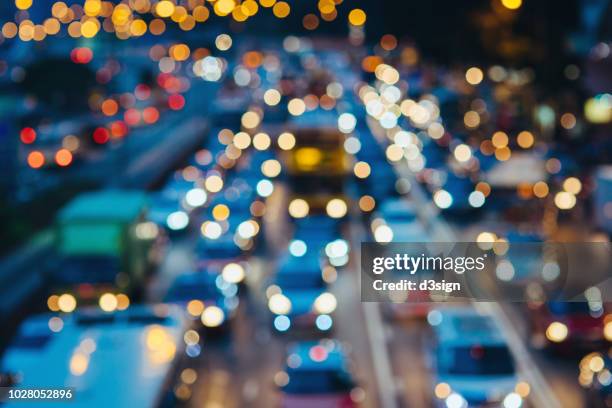 defocused image of rush hour traffic on busy highway in the evening - hong kong mass transit fotografías e imágenes de stock