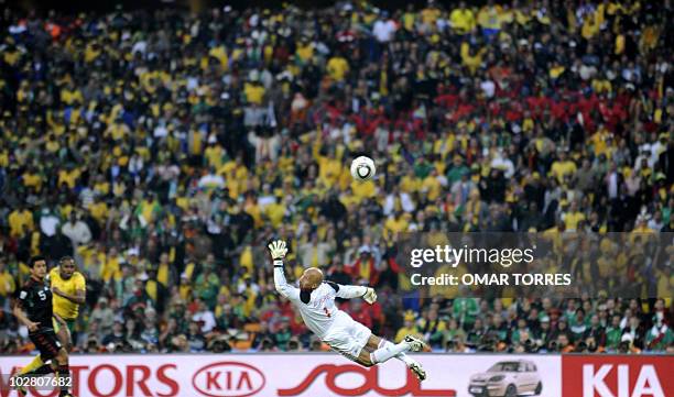 Mexico's goalkeeper Oscar Perez fails to catch a shot by South Africa's midfielder Siphiwe Tshabalala during their Group A first round 2010 World Cup...