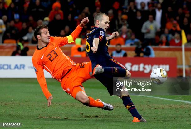 Andres Iniesta of Spain scores the winning goal as Rafael Van der Vaart of the Netherlands tries to block the shot during the 2010 FIFA World Cup...