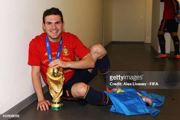 Juan Manuel Mata of Spain celebrates in the Spanish dressing room after they won the 2010 FIFA World Cup at Soccer City Stadium on July 11, 2010 in...