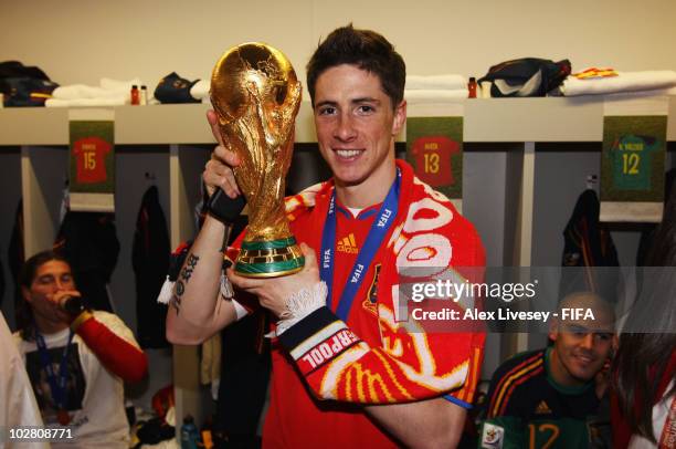 Fernando Torres of Spain celebrates in the Spanish dressing room after they won the 2010 FIFA World Cup at Soccer City Stadium on July 11, 2010 in...