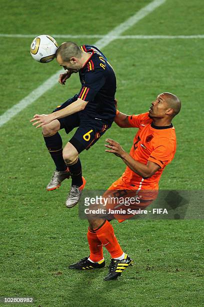 Andres Iniesta of Spain is challenged by Nigel De Jong of the Netherlands during the 2010 FIFA World Cup South Africa Final match between Netherlands...