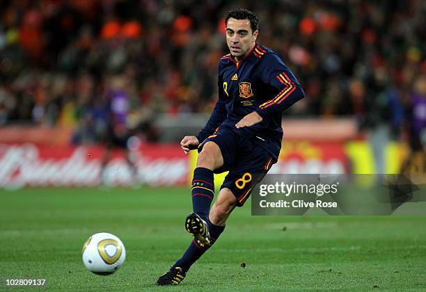 Xavi Hernandez of Spain passes the ball during the 2010 FIFA World Cup South Africa Final match between Netherlands and Spain at Soccer City Stadium...