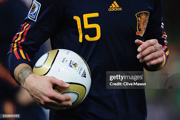 Sergio Ramos of Spain holds the jabulani match ball during the 2010 FIFA World Cup South Africa Final match between Netherlands and Spain at Soccer...