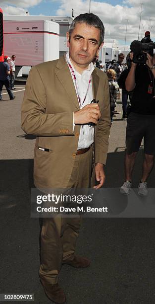 Rowan Atkinson visits the F1 paddock during race day ahead of the Formula One British Grand Prix at Silverstone on July 11, 2010 in Northampton,...