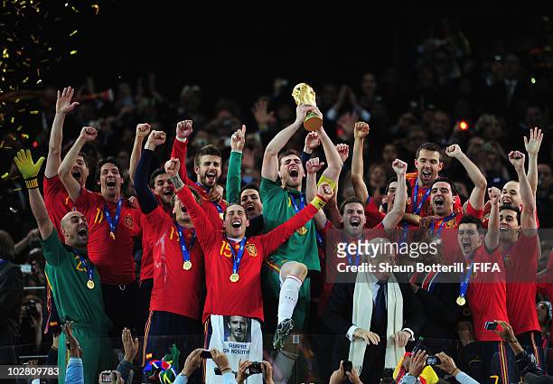 Iker Casillas of Spain lifts the World Cup after the 2010 FIFA World Cup South Africa Final match between Netherlands and Spain at Soccer City...