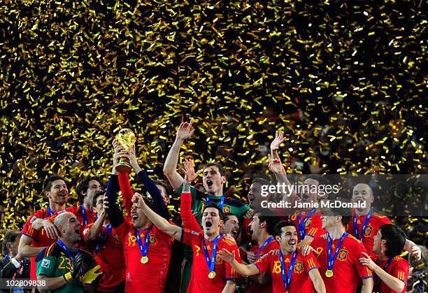 Fernando Llorente of Spain celebrates with team mates as he lifts the World Cup during the 2010 FIFA World Cup South Africa Final match between...