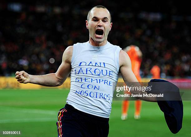 Andres Iniesta of Spain celebrates scoring his side's first goal during the 2010 FIFA World Cup South Africa Final match between Netherlands and...