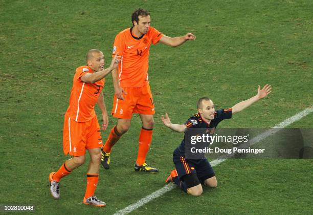 John Heitinga of the Netherlands appeals following his second bookable offence for a challenge on Andres Iniesta of Spain during the 2010 FIFA World...