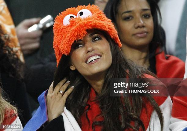 Netherlands' midfielder Wesley Sneijder's girlfriend Yolanthe Cabau smiles prior to the start of the 2010 World Cup football final Netherlands vs....