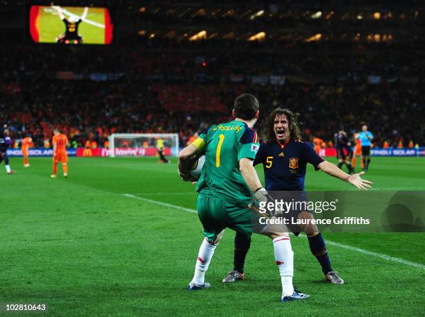 Iker Casillas and Carles Puyol of Spain celebrate victory at the final whistle during the 2010 FIFA World Cup South Africa Final match between...