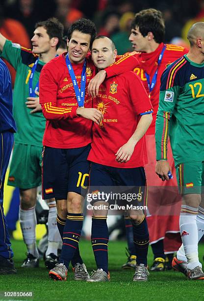 Francesc Fabregas and Andres Iniesta of Spain celebrate becoming World Cup champions following the 2010 FIFA World Cup South Africa Final match...