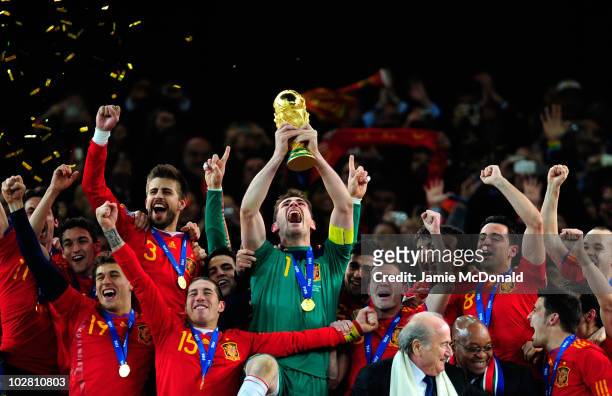 Iker Casillas of Spain celebrates lifting the World Cup with team mates during the 2010 FIFA World Cup South Africa Final match between Netherlands...