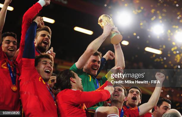 Iker Casillas of Spain lifts the World Cup after the 2010 FIFA World Cup South Africa Final match between Netherlands and Spain at Soccer City...