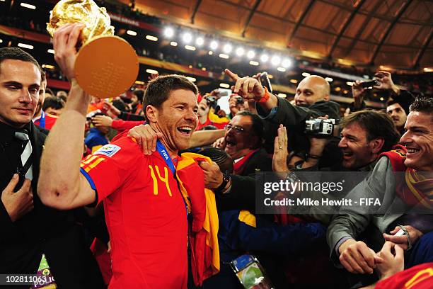 Xabi Alonso of Spain holds the World Cup after the 2010 FIFA World Cup South Africa Final match between Netherlands and Spain at Soccer City Stadium...