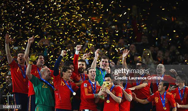 David Villa and Sergio Ramos of Spain lift the World Cup trophy as the Spain team celebrate victory following the 2010 FIFA World Cup South Africa...