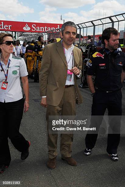 Rowan Atkinson visits the F1 paddock during race day ahead of the Formula One British Grand Prix at Silverstone on July 11, 2010 in Northampton,...