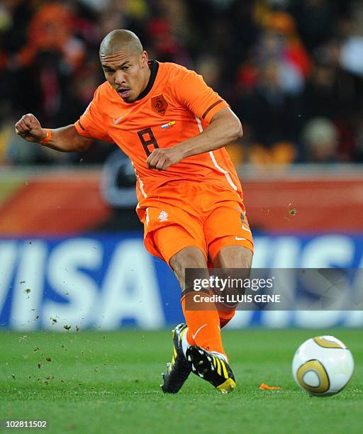 Netherlands' midfielder Nigel de Jong shoots the ball during the 2010 World Cup football final Netherlands vs. Spain on July 11, 2010 at Soccer City...