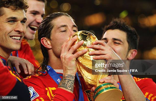 Sergio Ramos of Spain kisses the World Cup after the 2010 FIFA World Cup South Africa Final match between Netherlands and Spain at Soccer City...