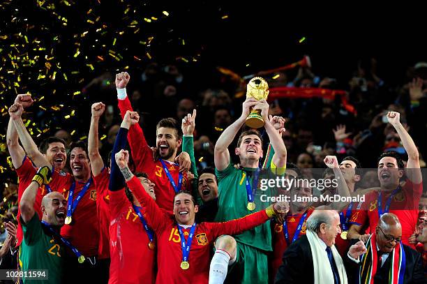 Iker Casillas of Spain celebrates as he lifts the World Cup with team mates during the 2010 FIFA World Cup South Africa Final match between...