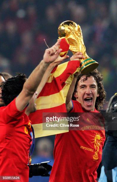Carles Puyol of Spain celebrates winning the World Cup during the 2010 FIFA World Cup South Africa Final match between Netherlands and Spain at...