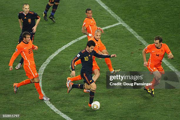 Francesc Fabregas of Spain charges through the Netherlands defence during the 2010 FIFA World Cup South Africa Final match between Netherlands and...