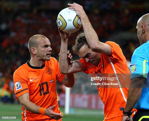 Angry Joris Mathijsen of the Netherlands throws the ball to the ground after he feels the goal scored by Andres Iniesta of Spain was offside as team...