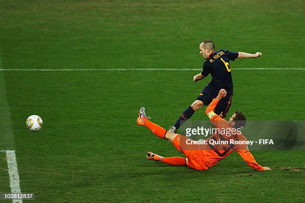 Andres Iniesta of Spain scores the winning goal beyond the challenge of Rafael Van der Vaart of the Netherlands during the 2010 FIFA World Cup South...