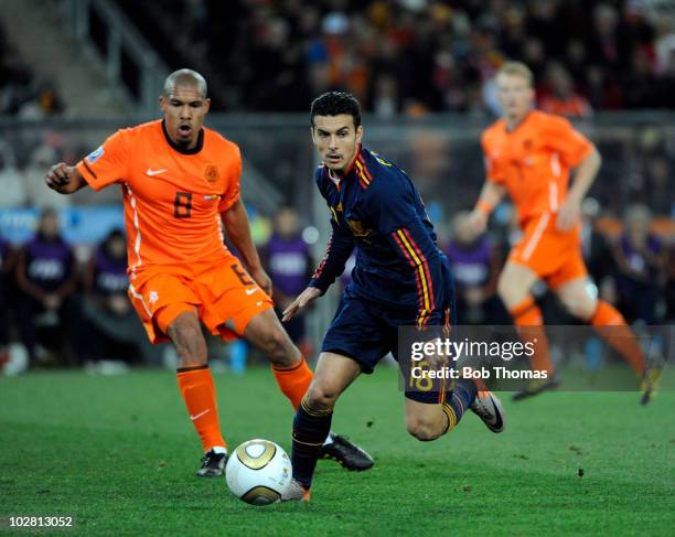 Pedro of Spain with Nigel De Jong of the Netherlands during the 2010 FIFA World Cup Final between the Netherlands and Spain on July 11, 2010 in...