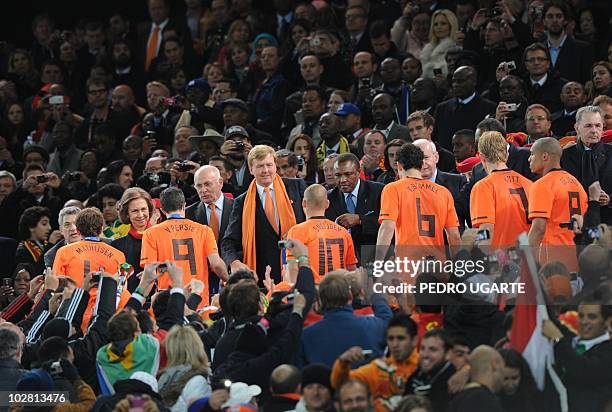 Players of The Netherlands receive their silver medals after losing the 2010 World Cup football final 1-0 to Spain in extra time at Soccer City...