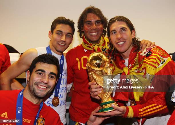 Sergio Ramos of Spain , Jesus Navas of Spain , Raul Albiol of Spain and tennis player Rafael Nadal pose in the Spanish dressing room after they won...