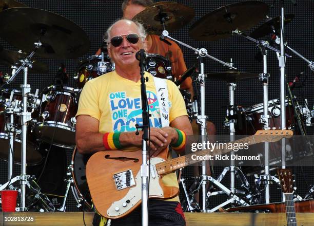 Musician Jimmy Buffett performs onstage at Jimmy Buffett & Friends: Live from the Gulf Coast, a concert presented by CMT at on the beach on July 11,...