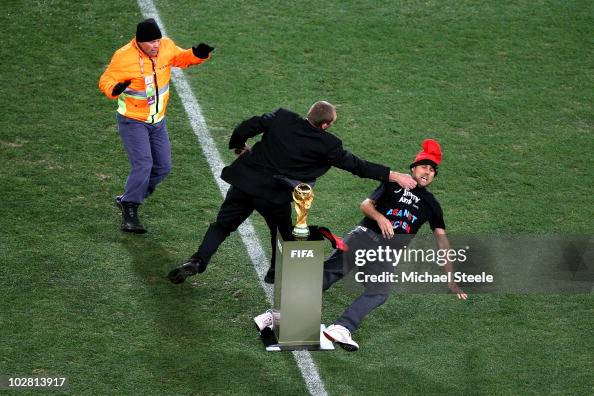 A Pitch Invader Jimmy Jump Is Wrestled Away From The World Cup By A Pitch Invader Jimmy Jump Is Wrestled Away From The World Cup By
