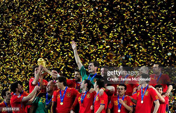 The Spain team celebrate winning the World Cup as captain Iker Casillas waves to fans during the 2010 FIFA World Cup South Africa Final match between...