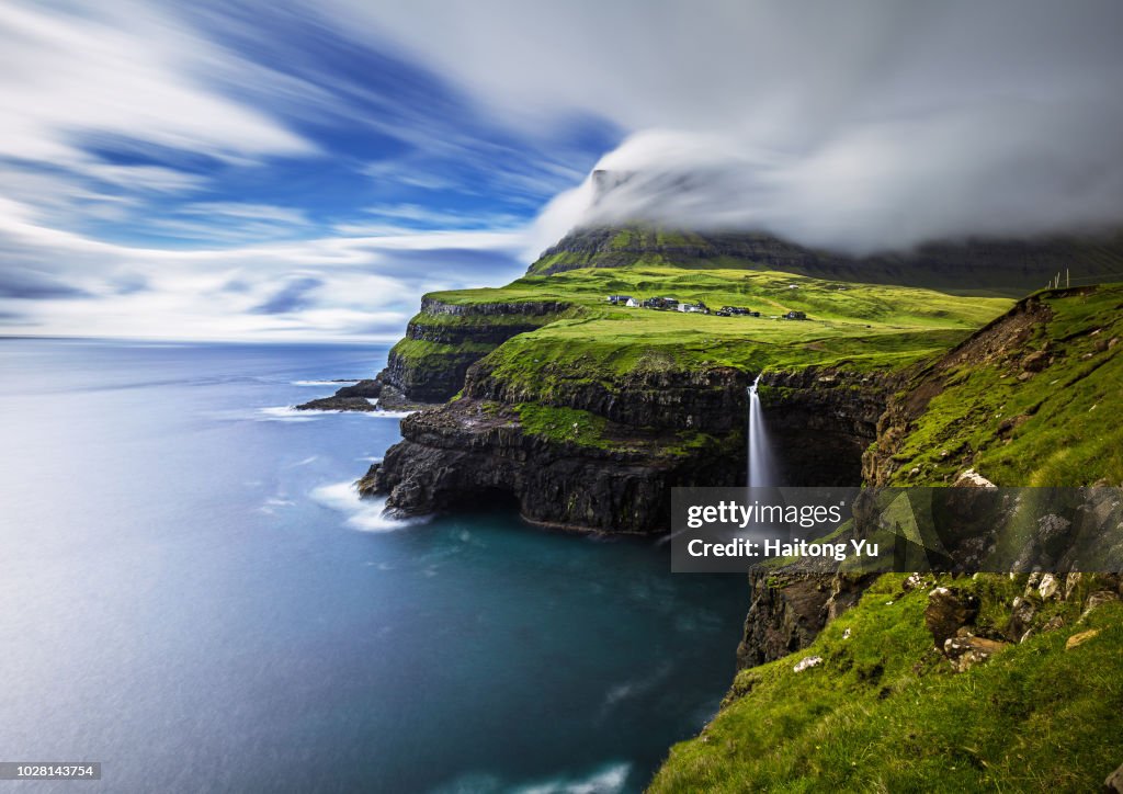 Vagar, Faroe Islands. Mulafossur waterfall. Long exposure shot.