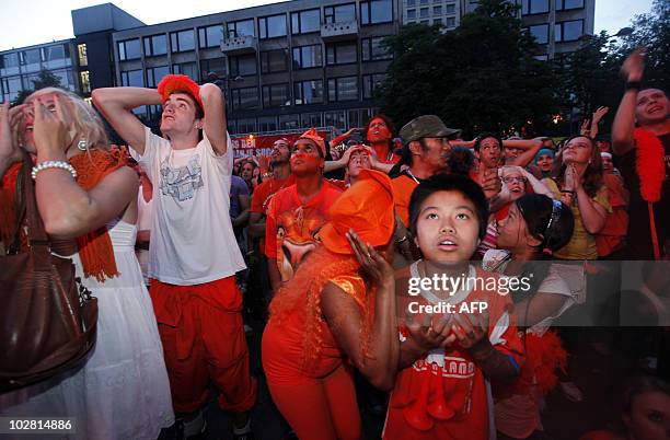 Dutch fans react in Rotterdam after the Netherlands football team lost the final match in the 2010 South Africa World Cup against Spain on July 11,...