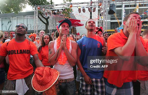 Dutch fans react in Rotterdam after the Netherlands football team lost the final match in the 2010 South Africa World Cup against Spain on July 11,...
