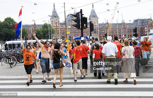 People exit Amsterdam Central Station towards the centre on July 11, 2010 to watch on screens the 2010 World Cup football final match opposing Spain...