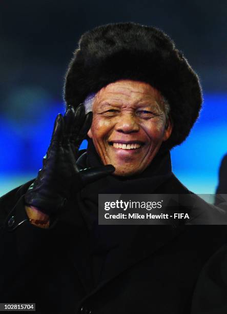 Former South African President Nelson Mandela waves during the closing ceremony before the 2010 FIFA World Cup South Africa Final match between...