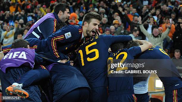 Spain's defender Gerard Pique , Spain's defender Sergio Ramos celebrate after Spain's midfielder Andres Iniesta scored during the 2010 FIFA football...