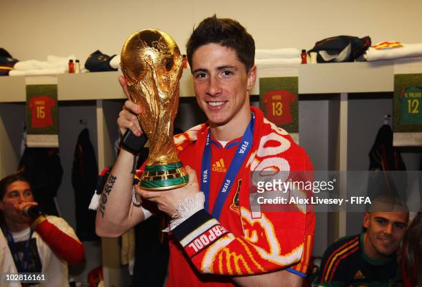 Fernando Torres of Spain celebrates in the Spanish dressing room after they won the 2010 FIFA World Cup at Soccer City Stadium on July 11, 2010 in...