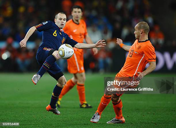 Wesley Sneijder of the Netherlands challenges Andres Iniesta of Spain during the 2010 FIFA World Cup South Africa Final match between Netherlands and...