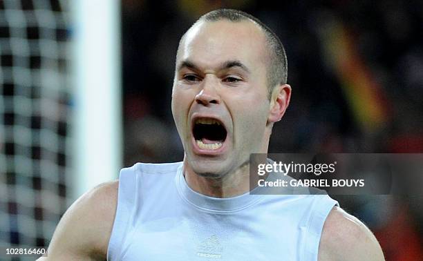 Spain's midfielder Andrés Iniesta celebrates his goal during extra time in the 2010 World Cup football final between the Netherlands and Spain on...